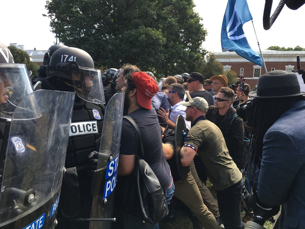 Image: ‘Unite the Right’ rally attendees clash with police in Charlottesville in 2017. (Courtesy of Wikimedia Commons)