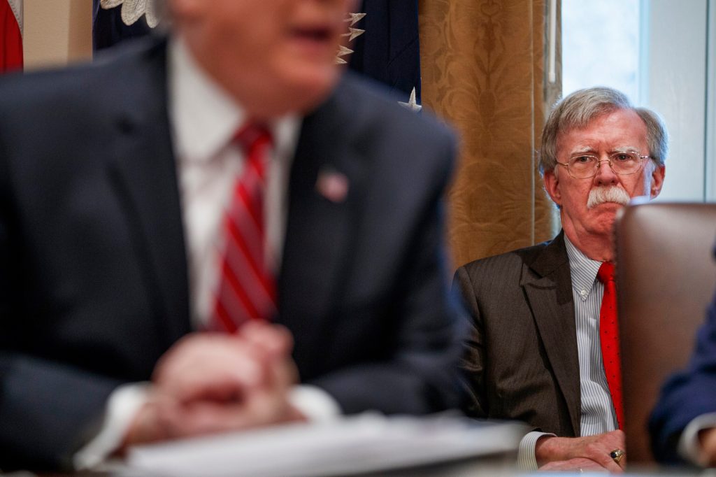 National security adviser John Bolton listens as President Donald Trump speaks during a cabinet meeting at the White House, Tuesday, Feb. 12, 2019, in Washington. (AP Photo/ Evan Vucci)