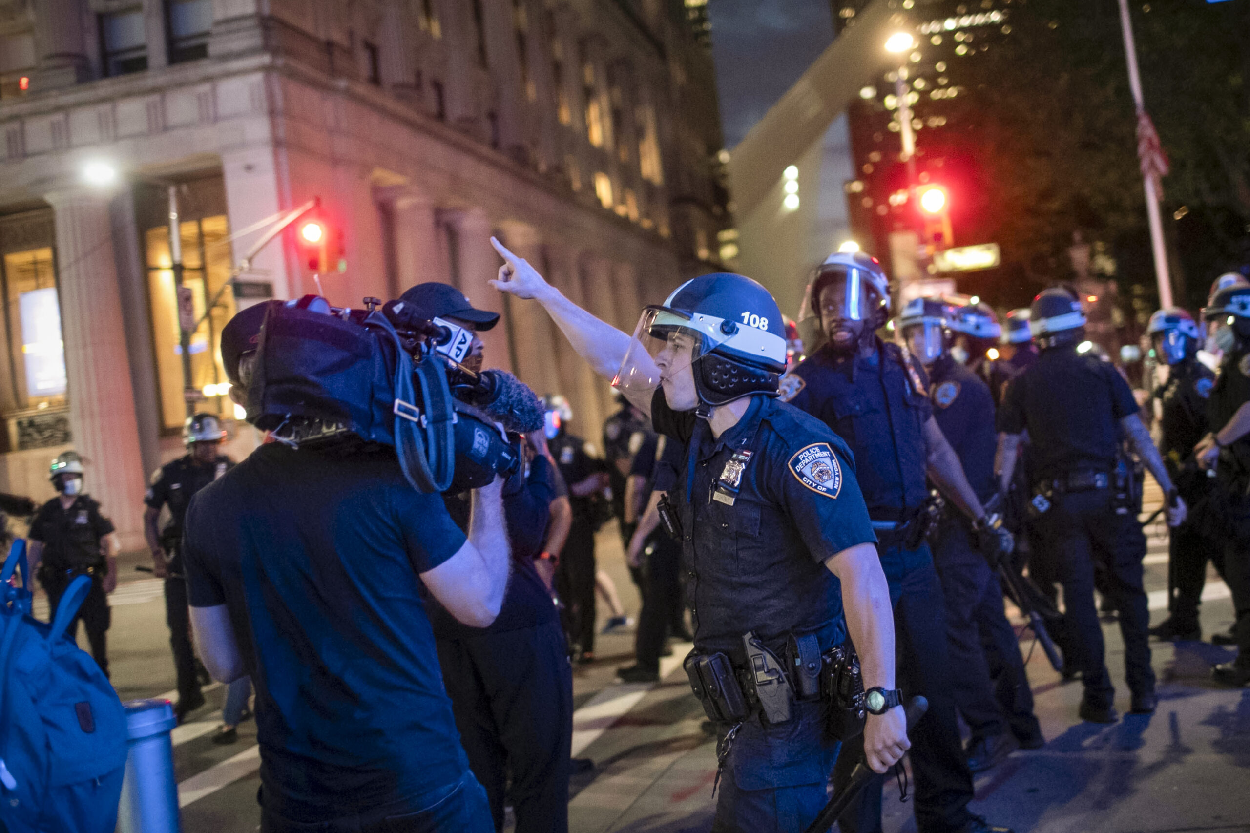 Photo of NYPD officer confronting AP photographer during protests in New York City