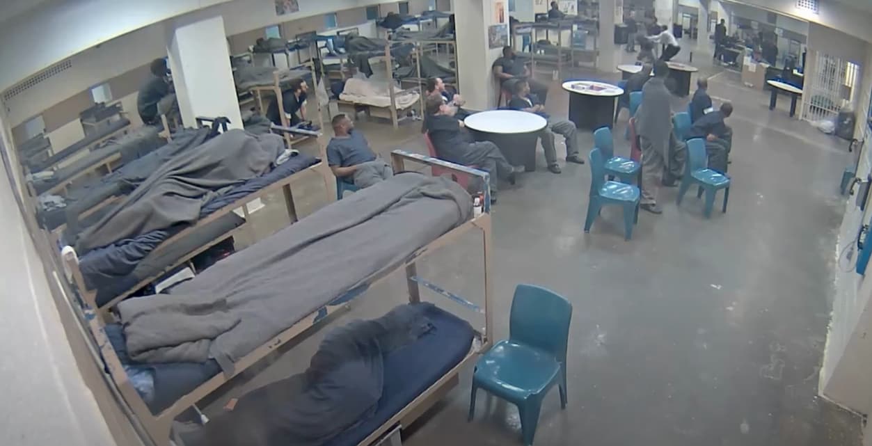 Screen grab of Shelby County Jail surveillance video showing a correctional officer assaulting an inmate