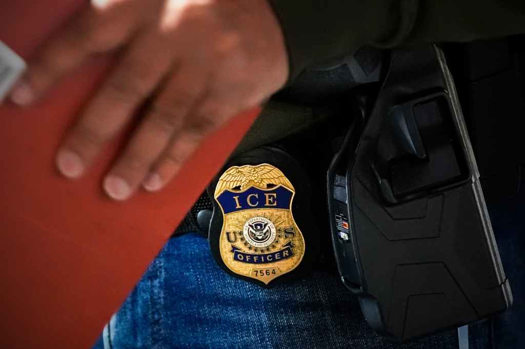 A deportation officer with U.S. Immigration and Customs Enforcement conducts a brief before an early morning operation, Dec. 17, 2024, in the Bronx borough of New York. (AP Photo/Julia Demaree Nikhinson, File)