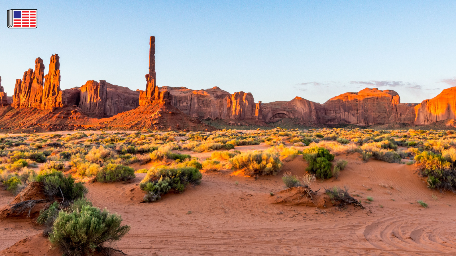 Monument Valley at Navajo Tribal Park at sunset. On the top left corner, the Reporters Committee flag logo is shown.