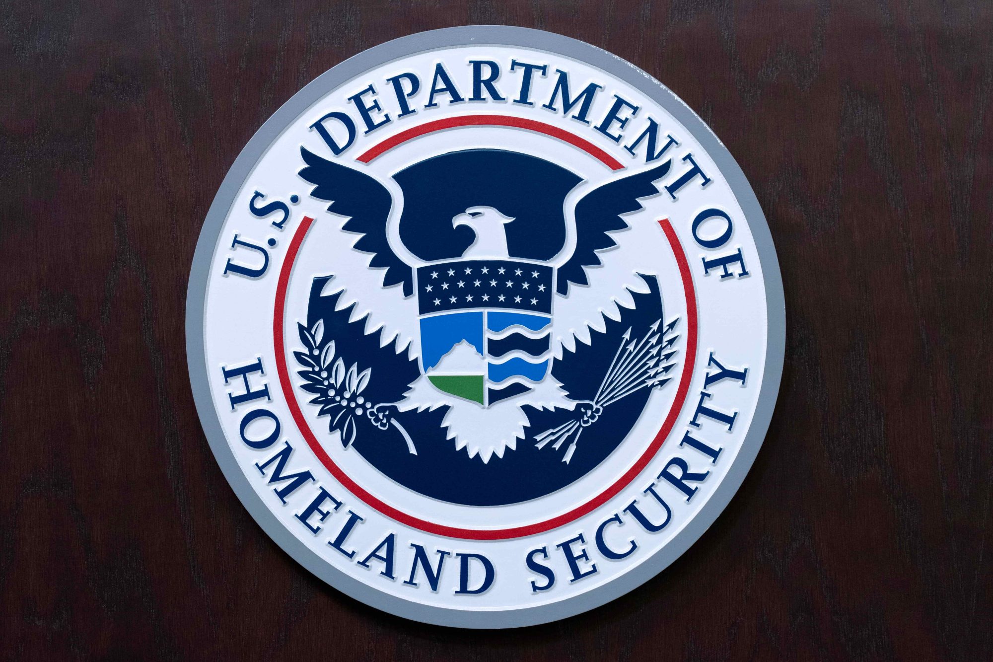 The seal of U.S. Department of Homeland Security is seen before the news conference with Acting director of U.S. Immigration and Customs Enforcement (ICE) Todd Lyons at ICE Headquarters, in Washington, Wednesday, May 21, 2025. (AP Photo/Jose Luis Magana)