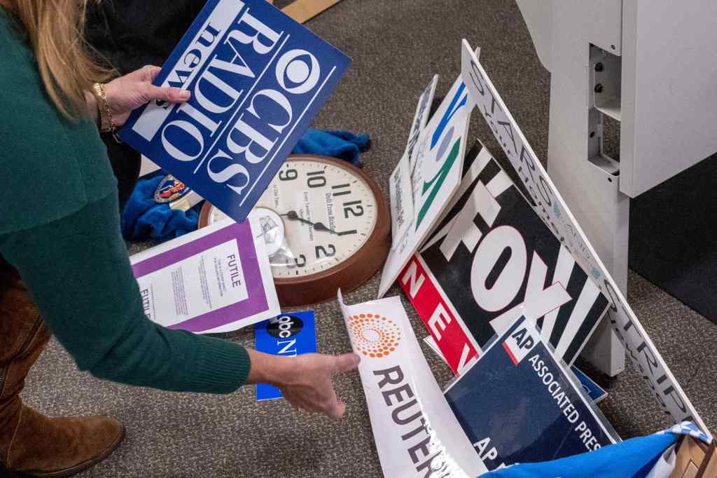 Journalists pack up their belongings in the press area in the Pentagon. (AP Photo/Kevin Wolf)
