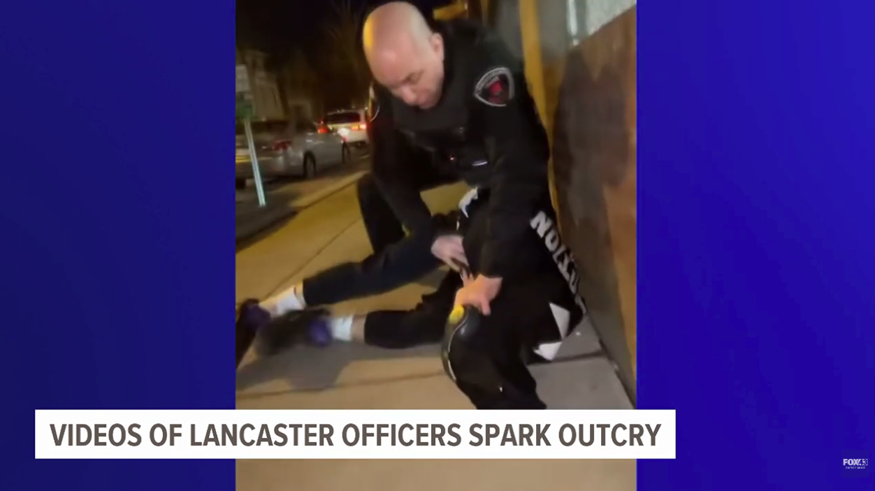 A screenshot taken from a Fox43 newscast shows a police officer arresting a teen in Lancaster, Pennsylvania. Footage of the arrest, which was captured by a bystander, prompted calls for the officers involved to be fired.