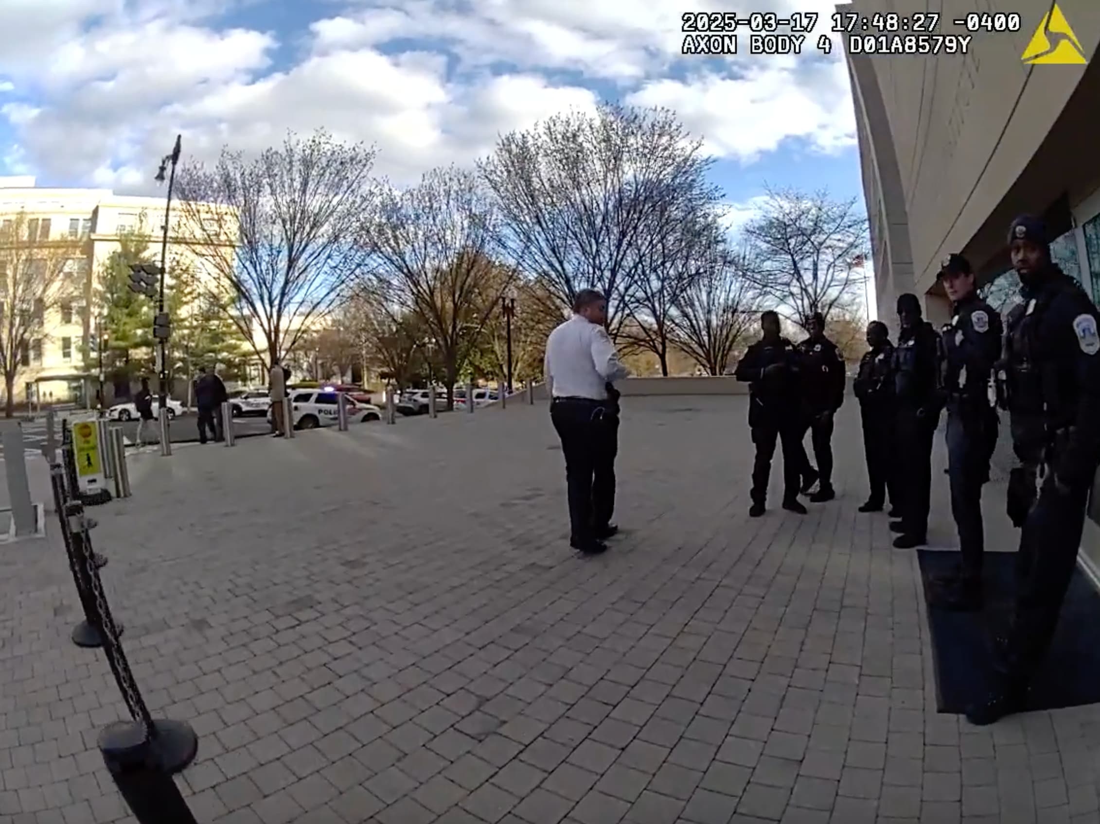 An image from bodycam videos released to journalist Marisa Kabas in 2025 shows police officers standing outside the U.S. Institute of Peace headquarters in Washington, D.C.