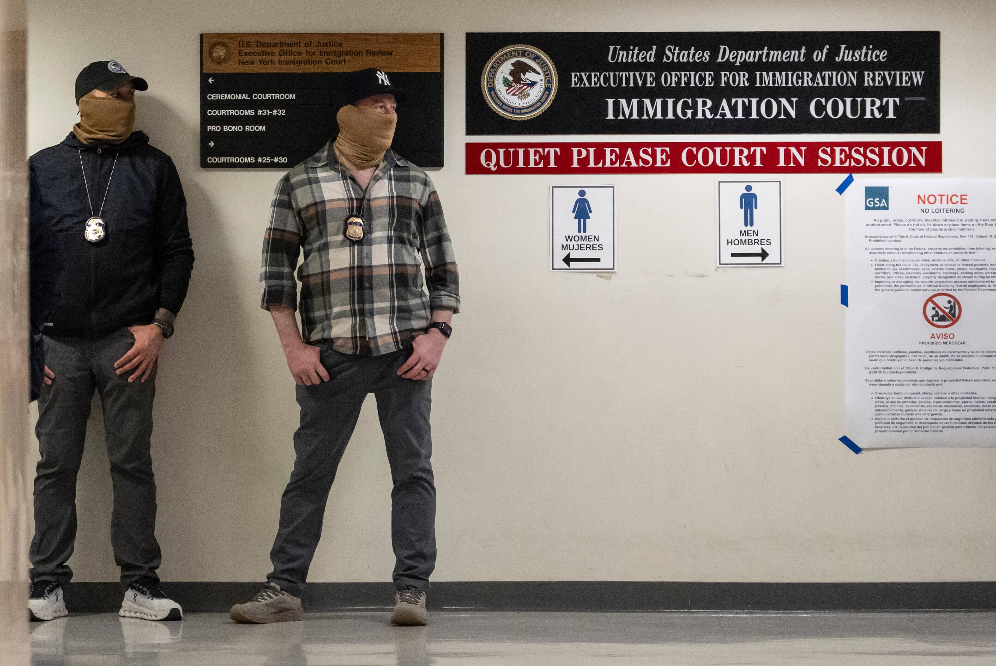 Federal agents stand outside immigration court at the Jacob K. Javits federal building, Friday, March 6, 2026, in New York. (AP Photo/Yuki Iwamura)